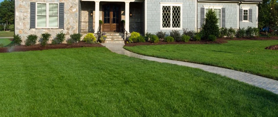 House in Wayne, NJ, with a front walkway and green lawn.